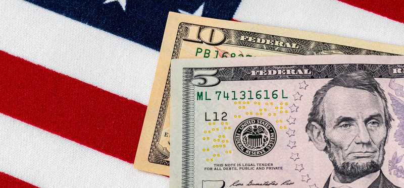 U.S. currency on flag background
