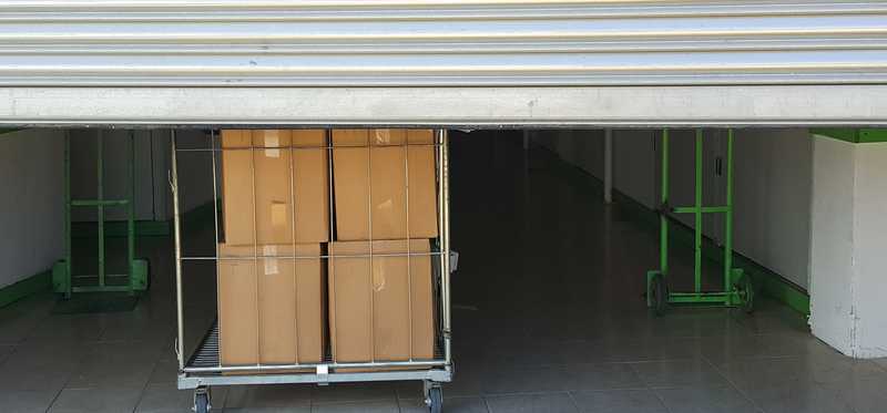 A storage unit with the door halfway raised.