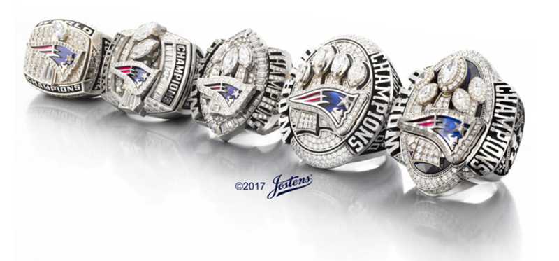 Patriots Super Bowl rings lined up.