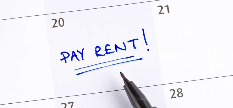 Calendar with the words Pay Rent written on it.