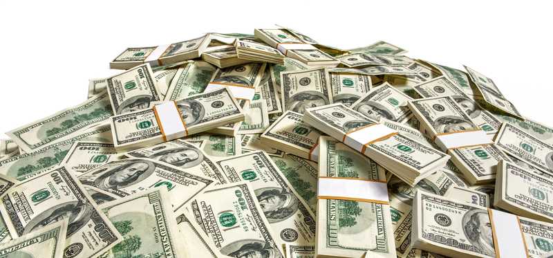 Hundred dollar bills in a huge pile.