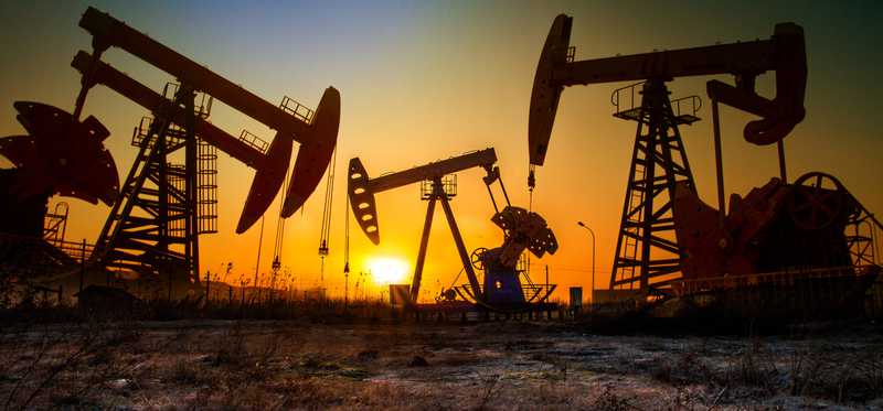 Oil pumping units in the sunset.