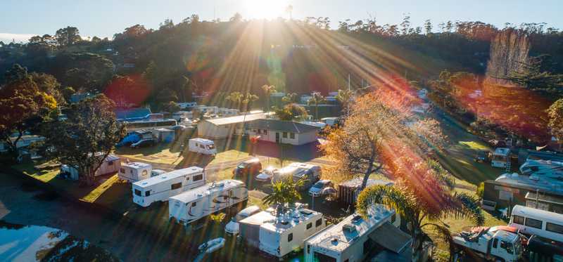 An RV park nestled among trees.