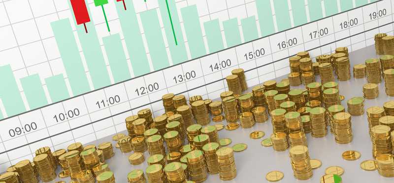 Random stacks of gold coins in front of a bar and volume chart.