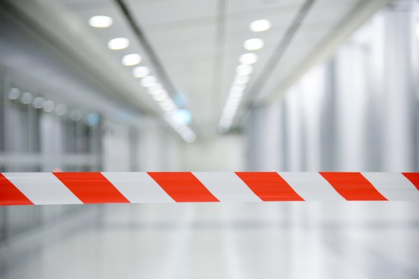 Barrier tape with red and white lines.