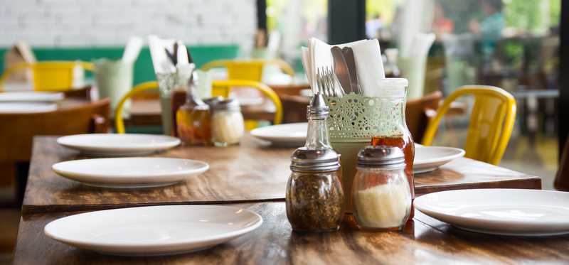 Tables set in a restaurant.