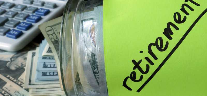 Retirement jar filled with cash