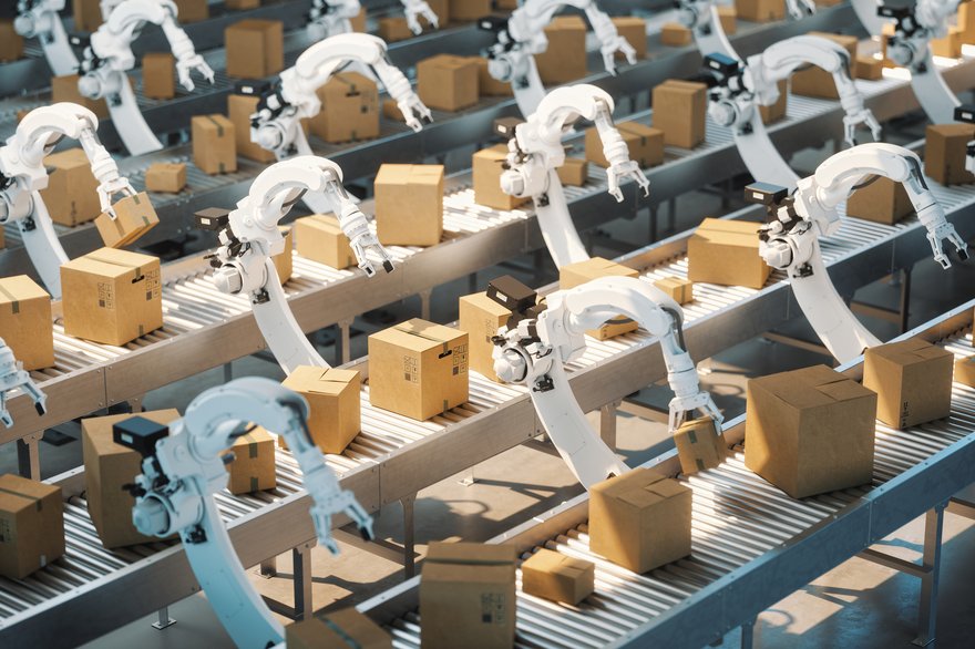 Robots in an assembly line in a factory, appearing the way that human workers normally do.