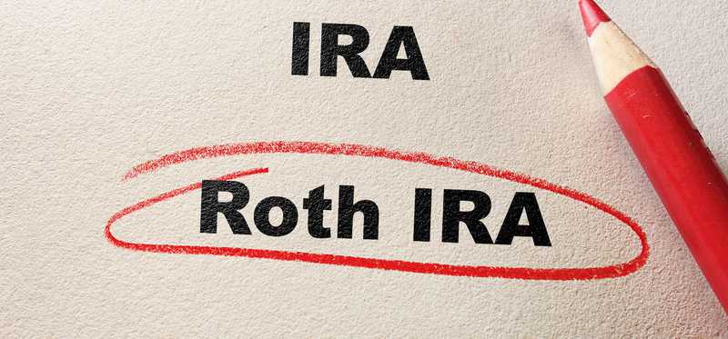 IRA and Roth IRA typed on paper with Roth IRA circled in red pencil.
