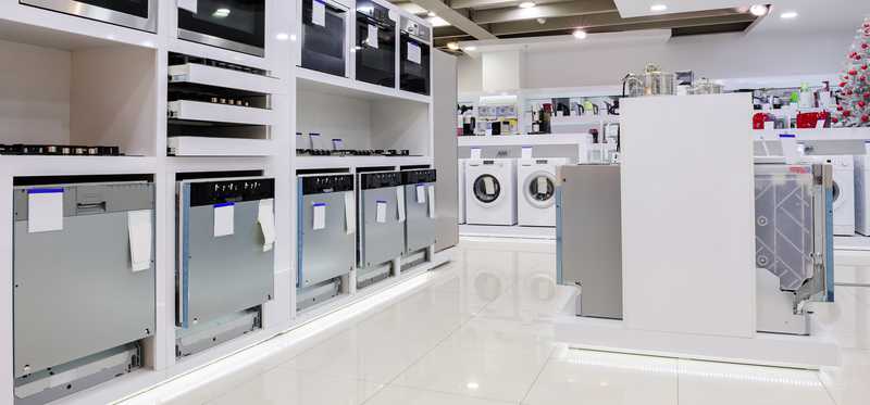 Appliances on a sales floor in a store.