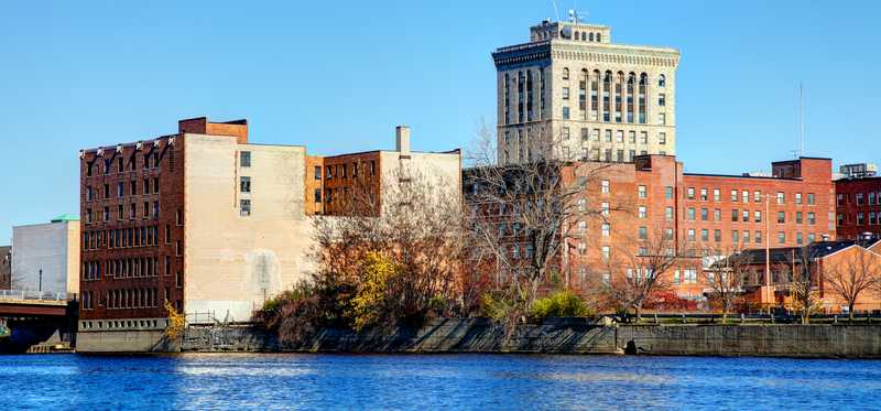 Downtown Saginaw, Michigan, with the Saginaw River in the foreground.