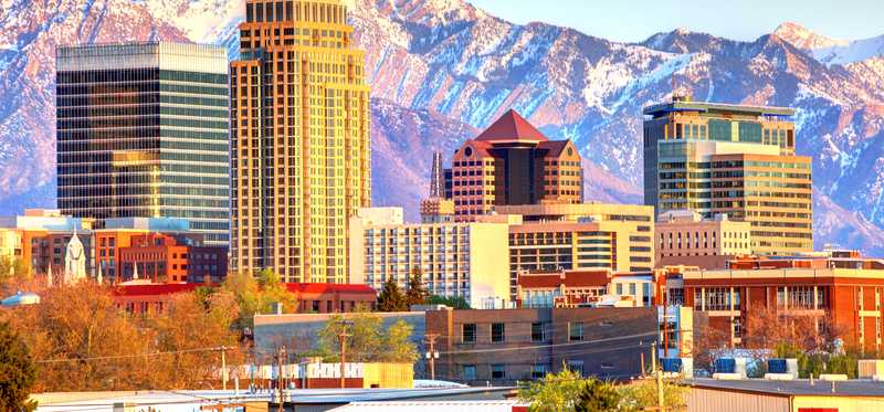 Downtown Salt Lake City, Utah, with snowy mountains in the near background.
