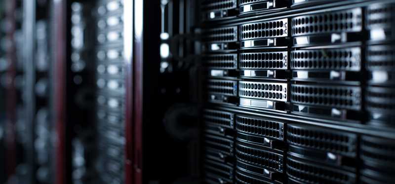 A wall of servers in a server room.