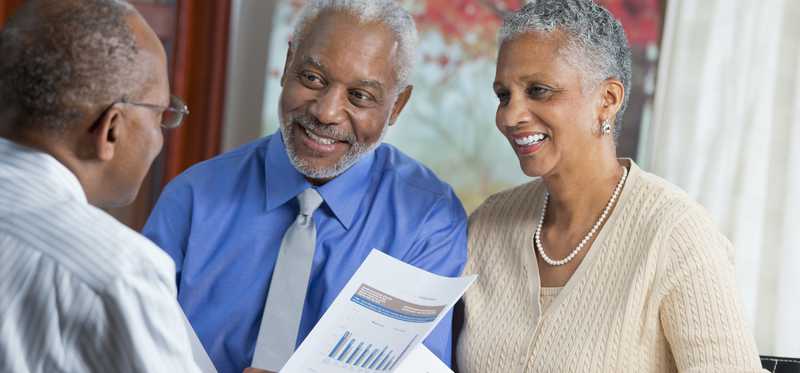 Financial advisor meeting with clients.