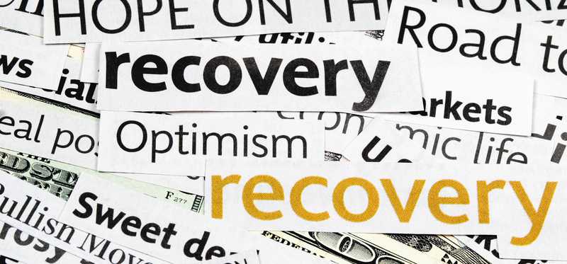 Clippings of newspaper headlines after market crash saying Recovery and more.