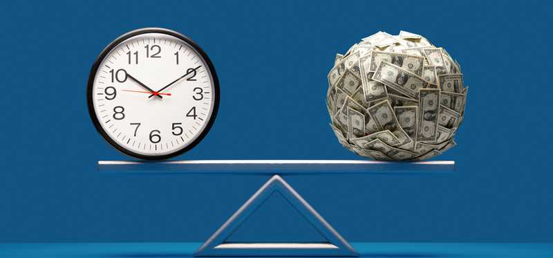 Scale with ball of cash on one end and clock at the other