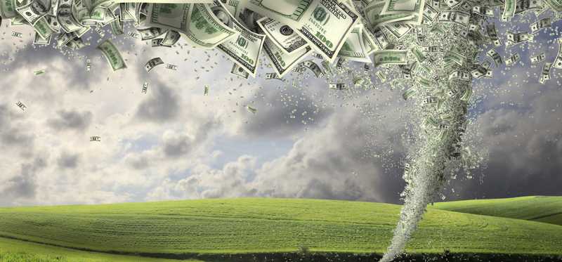 Tornado of money in countryside.