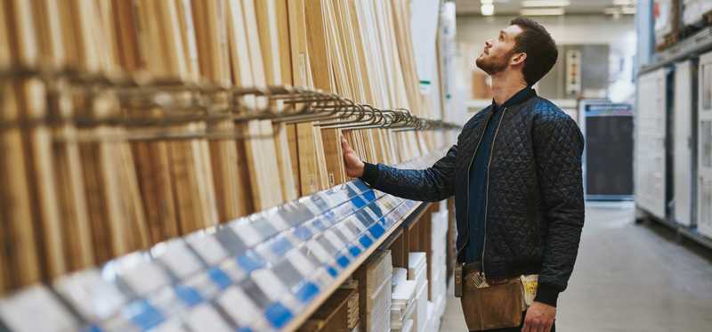 Person standing in aisle of hardware store.