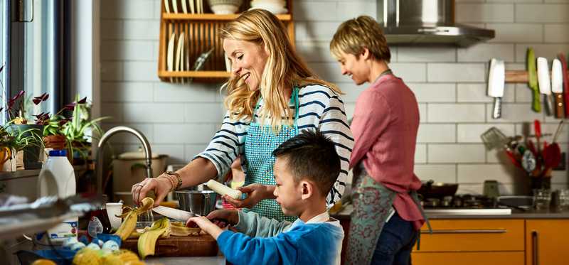 Family preparing meal in kitchen.