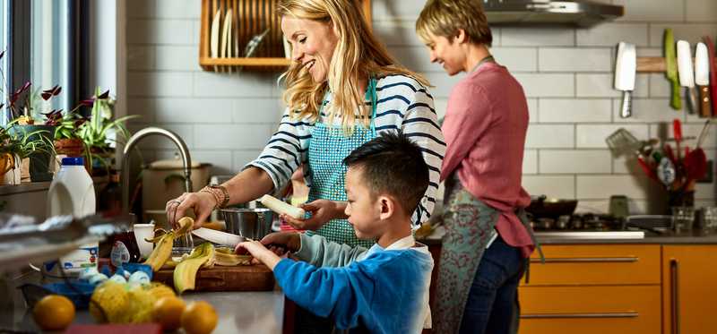 Family preparing meal in kitchen.