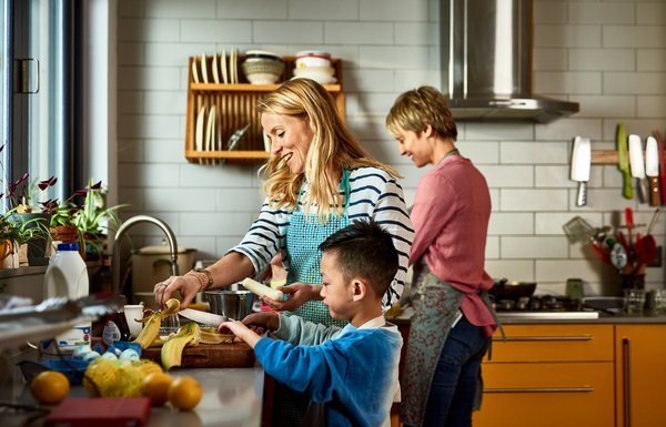 Family preparing meal in kitchen.