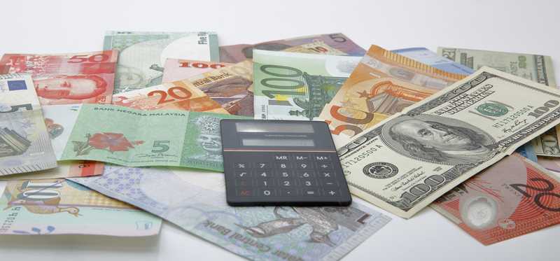 Pile of various country banknotes.