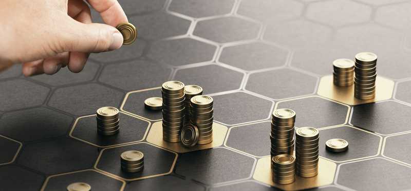 Stacks of coins on patterned table