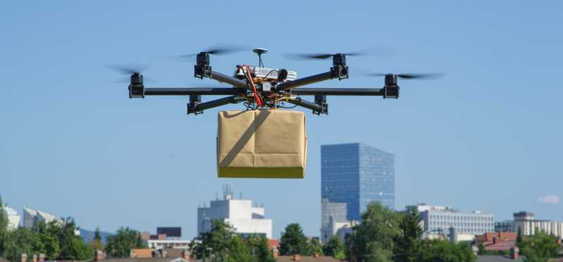 Drone delivering a package.