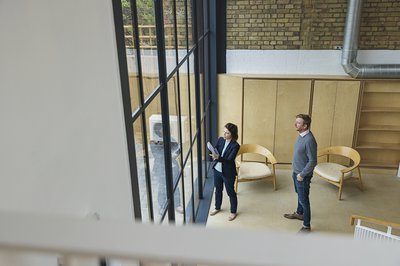 Real estate agent showing a customer a commercial property.