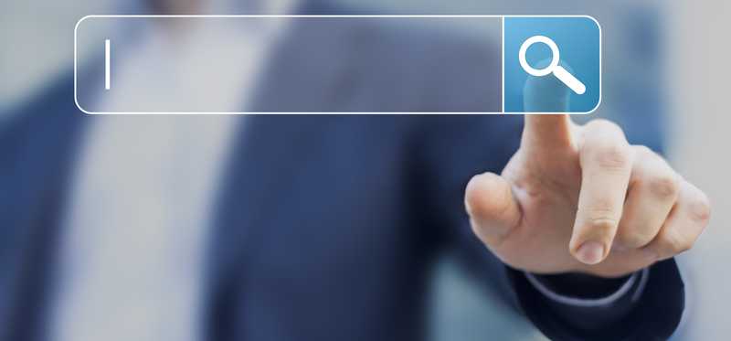 Man touching magnifying glass button on floating search bar