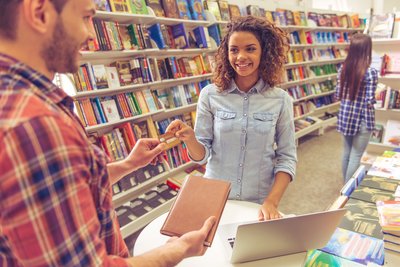 Customers shopping in a bookstore.