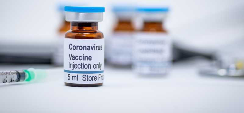 Syringe and coronavirus vaccine injectable.