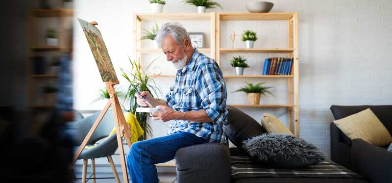 Person painting on a canvas.
