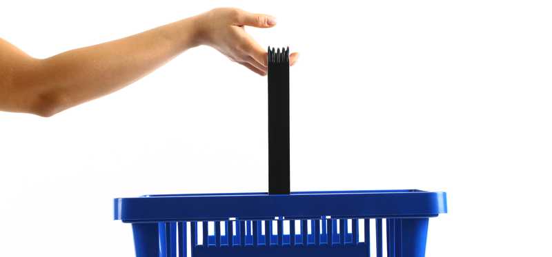 Hand holding blue shopping basket in the air.