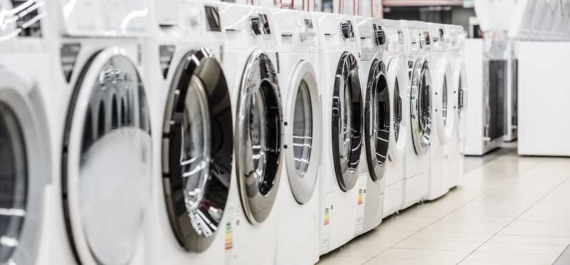 Row of washers in home appliances store
