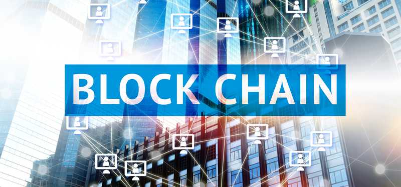 The words blockchain overtop spherical shape linked by shapes.
