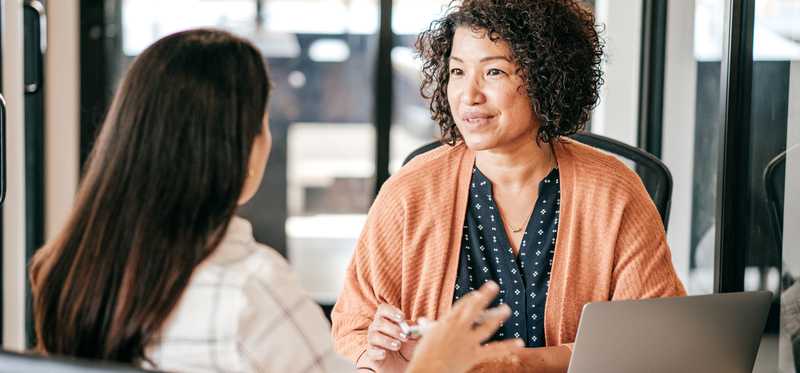 Two people meeting in an office.