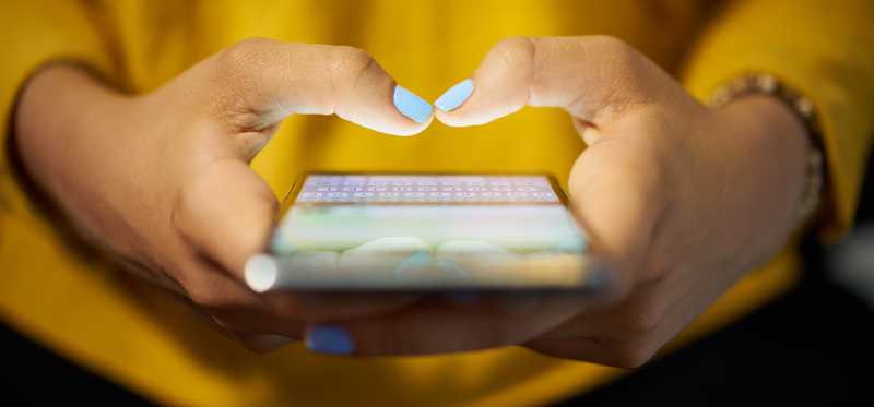 Woman using a cell phone.