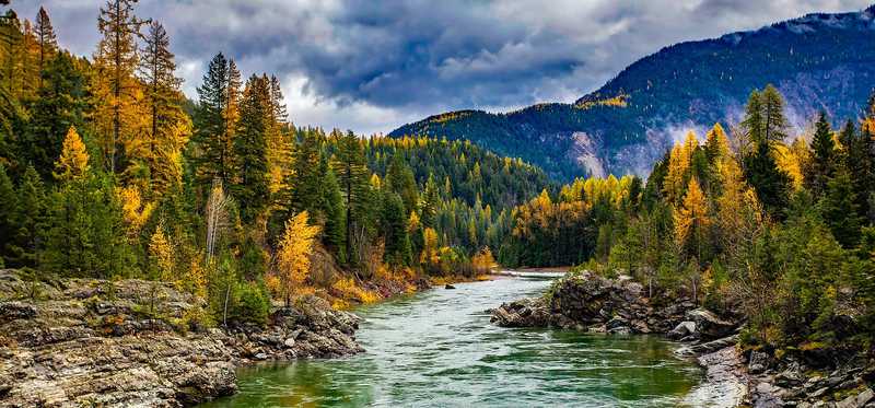 A river through the woods and mountains.