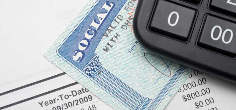 Social Security card with document and calculator.