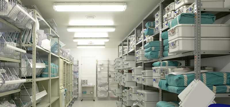 Back room in hospital containing shelves filled with medical supplies
