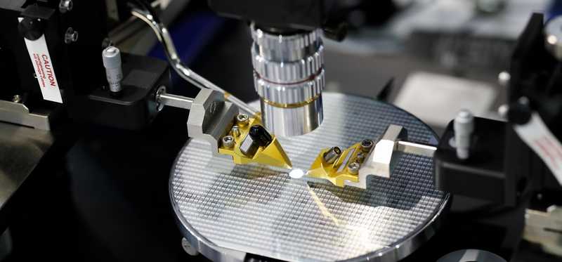 Semiconductor chip being manufactured in factory.