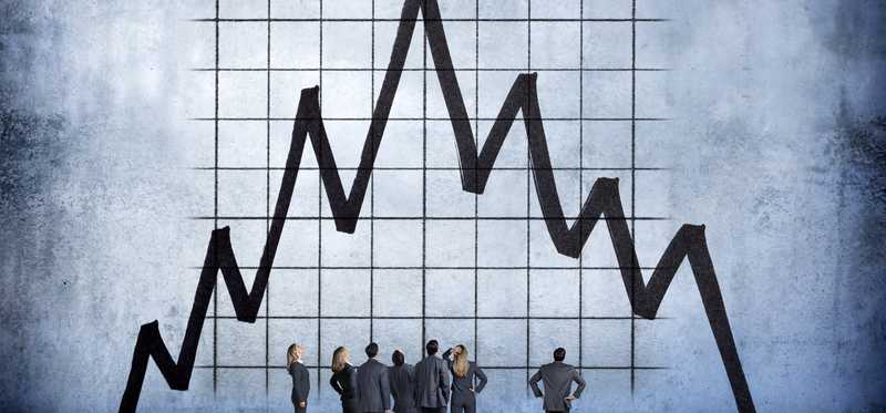 Illustration of businesspeople standing and looking at crash on giant stock chart.