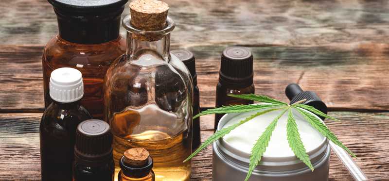 Hemp-derived products and oils on wood table