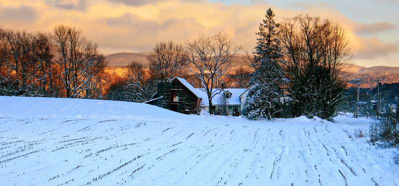 A rural farm blanketed in snow.