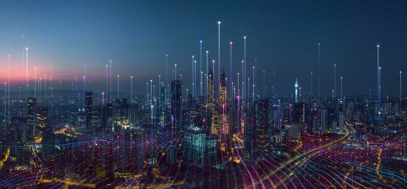Colorful telecom signals shooting upward into the sky from skyscrapers in big city