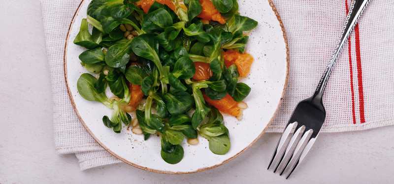 Plate of greens on table