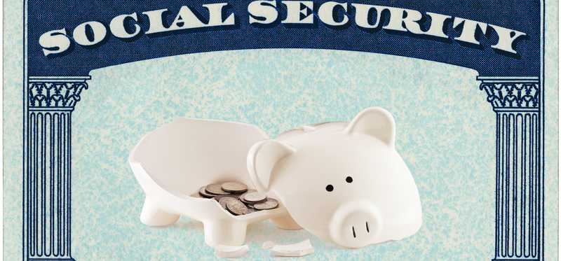 A broken piggy bank inside a social security card.