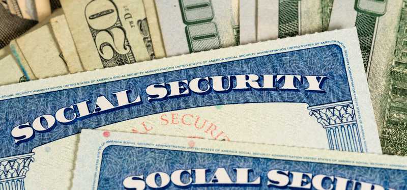 Social Security cards on various bills.