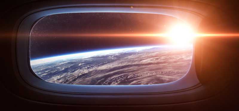 View out the window of a vehicle in space flight.